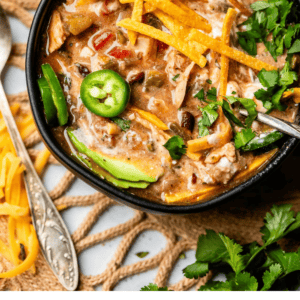 Pinterest image of bowl of soup with text "chicken tortilla soup".