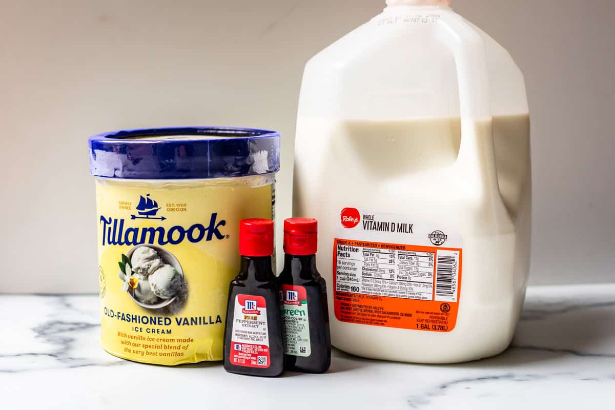 ingredients for shamrock shake: vanilla ice cream, milk, peppermint extract, food coloring.