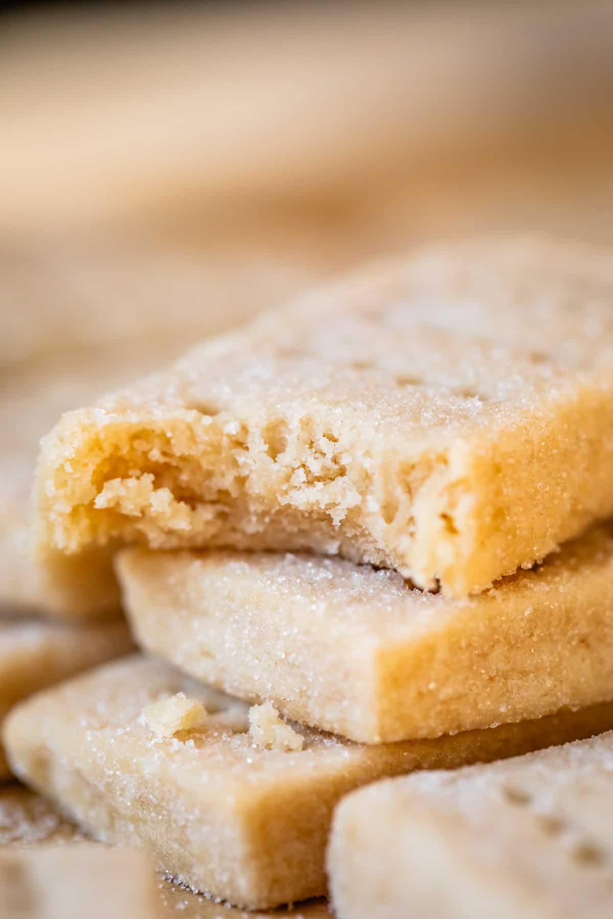 close up shot of rectangle shortbread cookie with bite taken out.
