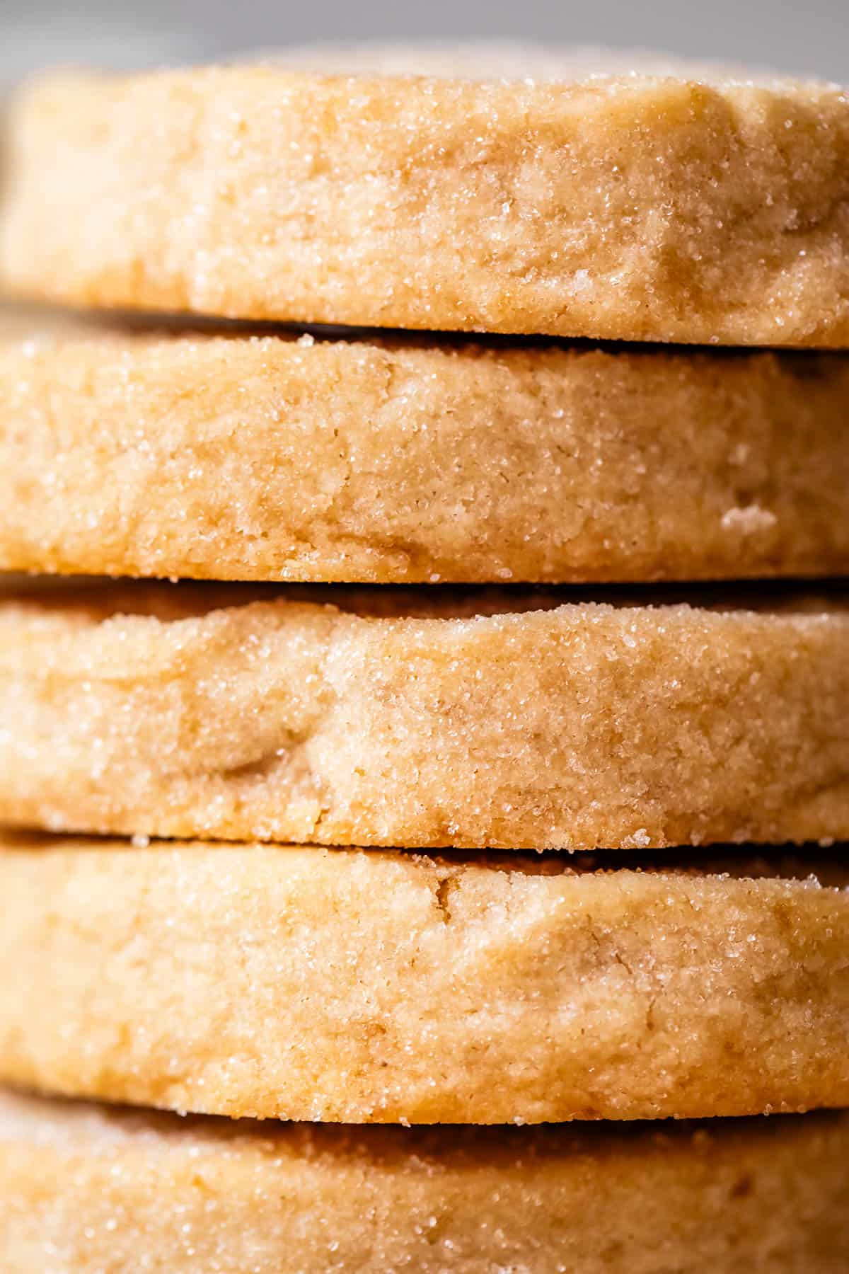 very close up shot of the side of round shortbread cookies to show thickness.