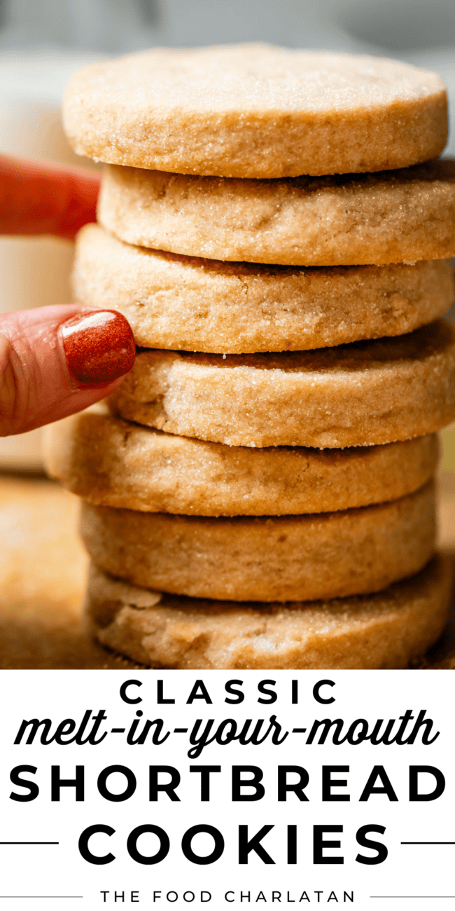 fingers pulling at stack of round shortbread cookies.
