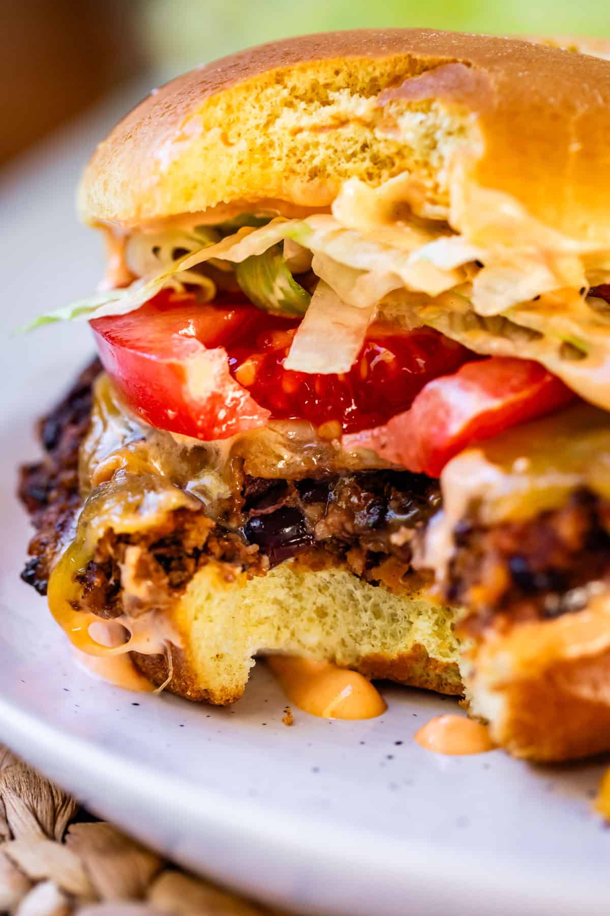black bean burger close up with a bite taken out of it.