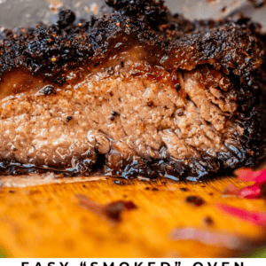 knife slicing into charred brisket.