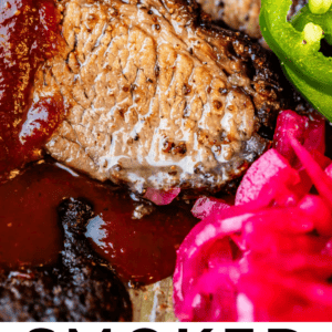 brisket on a plate with pickled onions and jalapeno.