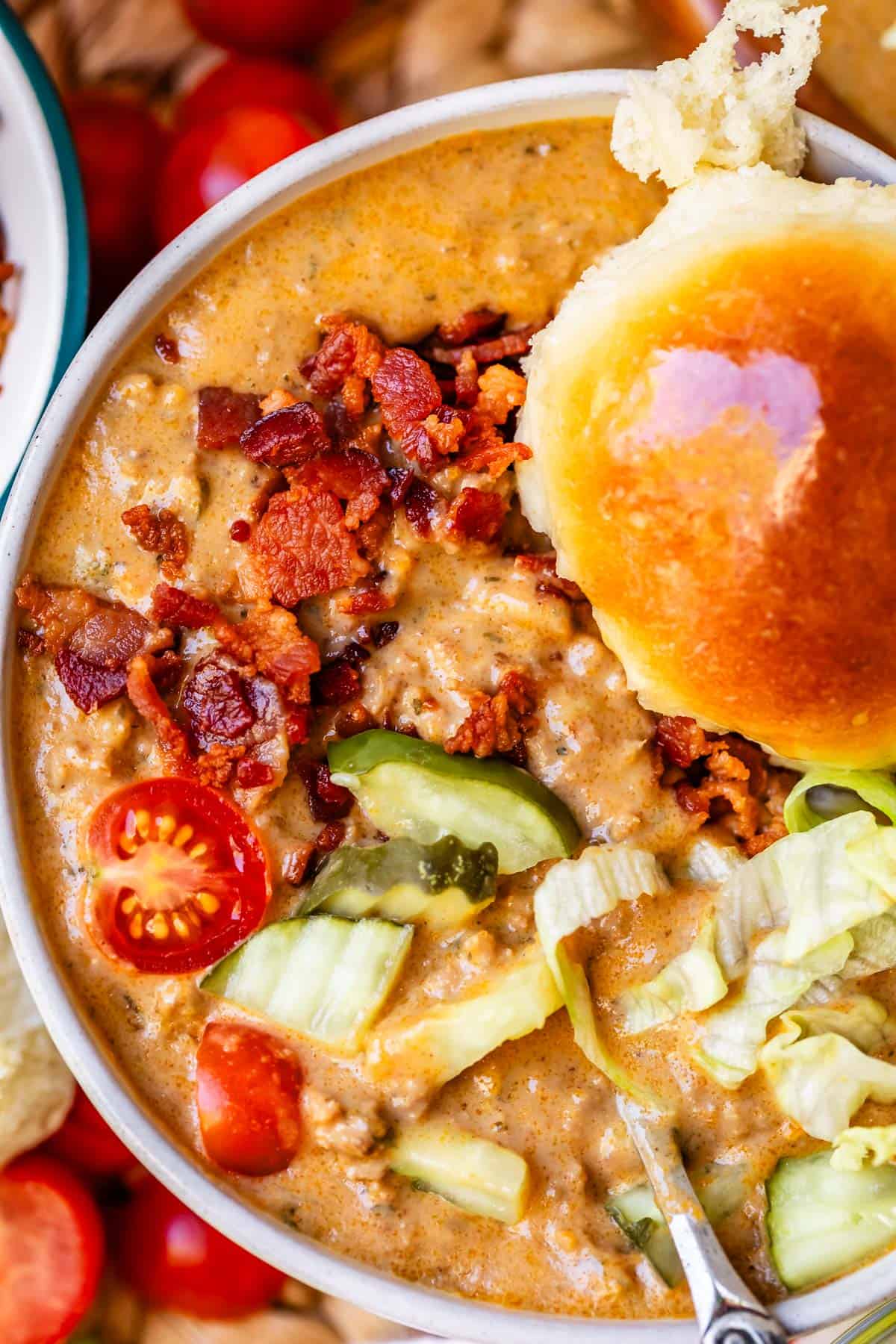 cheeseburger soup with a buttered bun.