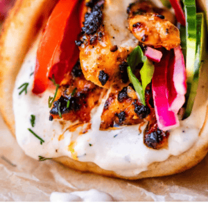 pinterest image of chicken shawarma with text "better than takeout chicken shawarma".