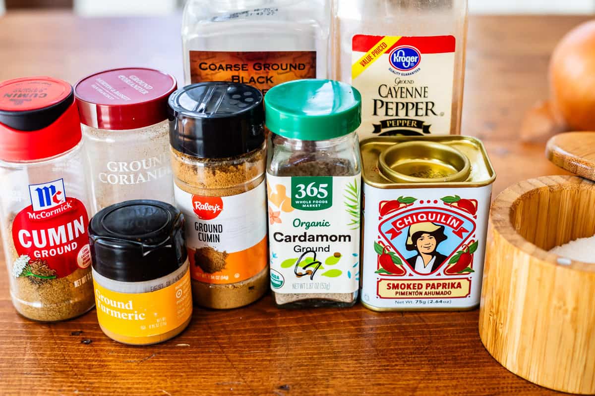 several spice bottles to show the spices needed for chicken shawarma marinade.