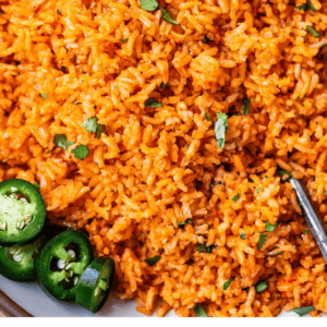 pinterest image of arroz rojo with text "better than takeout Mexican rice".