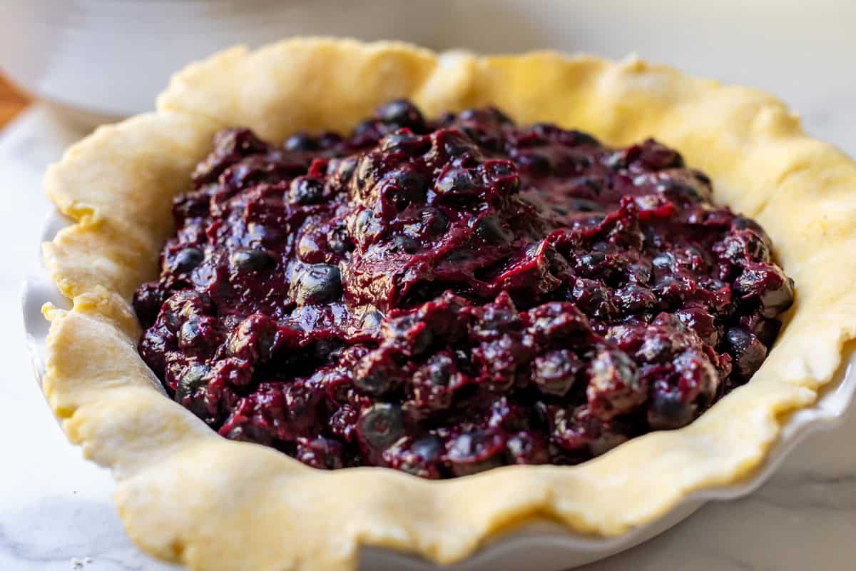 blueberry pie filling in an unbaked pie shell.