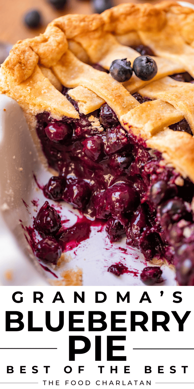 blueberry pie with berries on top in the pie pan.
