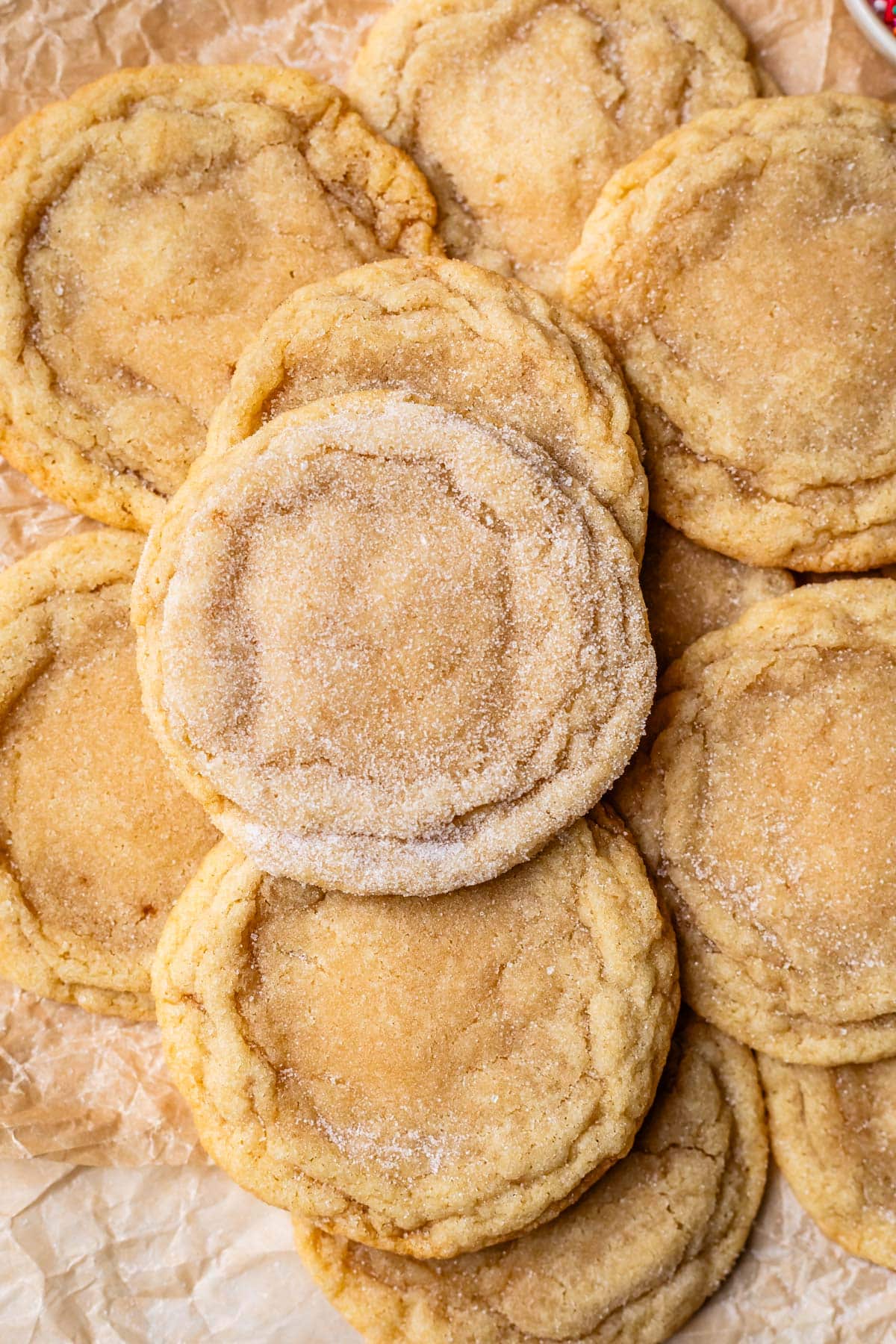 one more heavily sugared drop cookie on top of a pile of about a dozen more cookies.