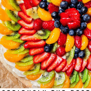 overhead shot of fruit pizza with strawberries, blueberries, kiwi, etc.