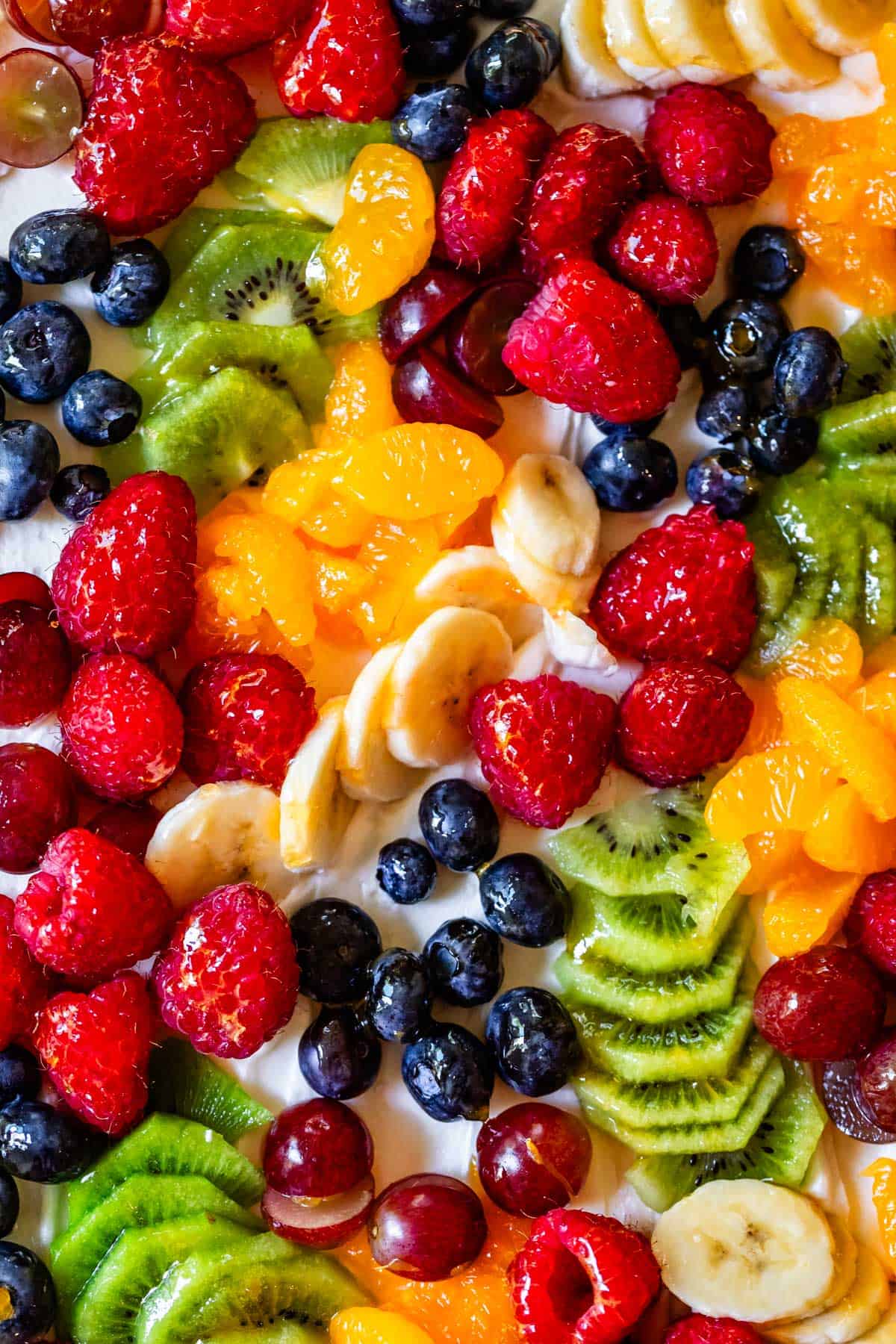 looking straight down at a rectangular cookie pizza showing fruit groupings instead of concentric circles.