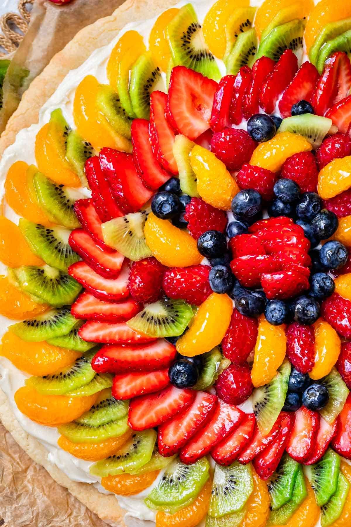 fruit pizza on a circle crust showing the many beautiful layers of fruit.