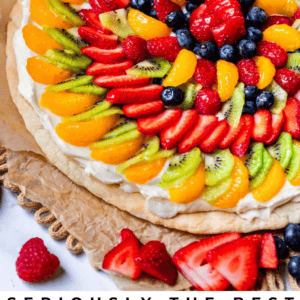 pinterest image of fruit topped cookie with text "seriously the best fruit pizza of your life".