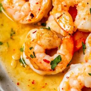 close up shot of shrimp in garlic butter sauce.