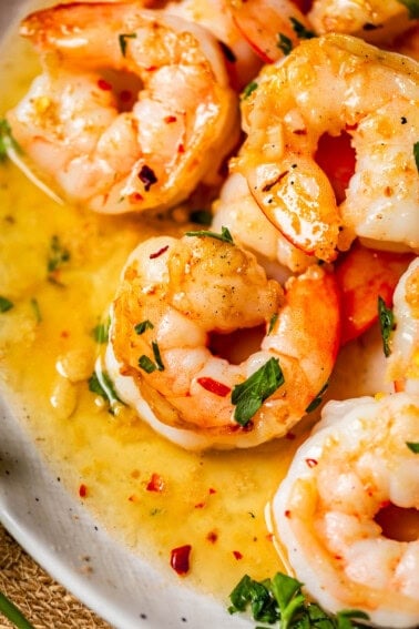close up shot of shrimp in garlic butter sauce.
