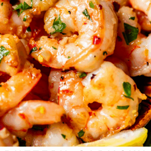 pinterest image of shrimp and noodles with text "buttery garlicky shrimp scampi".