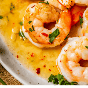 pinterest image of shrimp and noodles with text "buttery garlicky shrimp scampi".