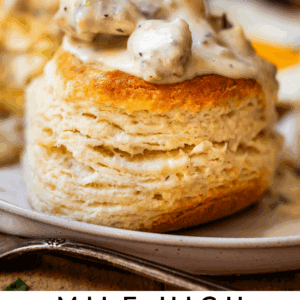 pinterest image of gravy over biscuits with text "mile high biscuits & gravy pure comfort food".