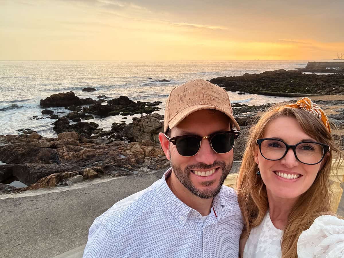 man and woman at the beach smiling.