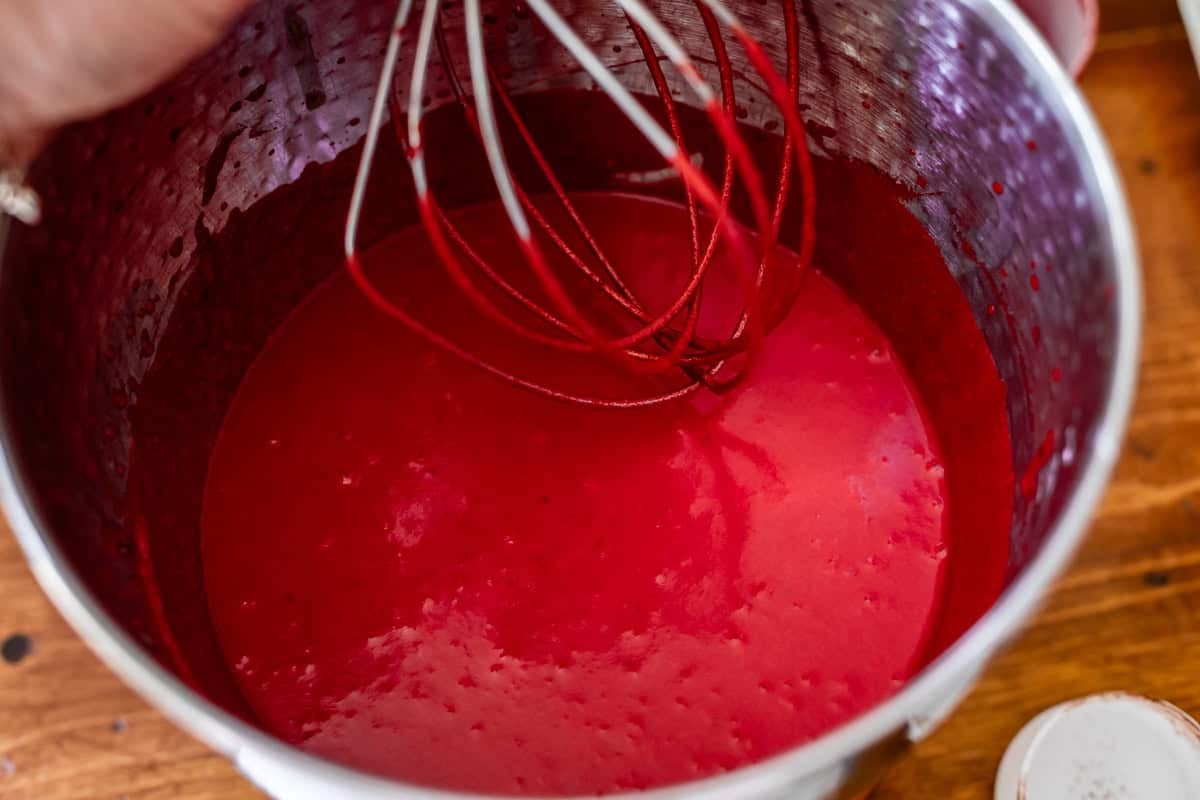 combined wet ingredients for the cake in a metal mixing bowl.