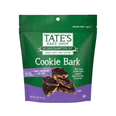 A green resealable pouch of Tate’s Bake Shop Cookie Bark, featuring an image of dark chocolate and sea salt-covered cookie pieces on the front. The package highlights dark chocolate cookie bark with sea salt.