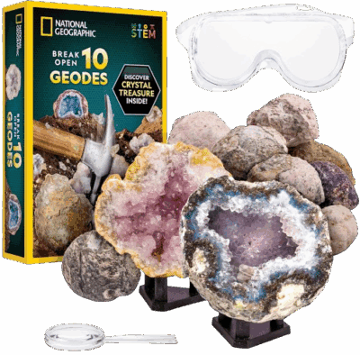 A National Geographic geode kit with a box, 10 unopened geodes, 2 opened geodes showing crystals, a magnifying glass, a small hammer, safety goggles, and two display stands.