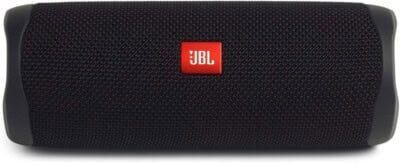 A black JBL portable Bluetooth speaker with a red and white JBL logo in the center, mesh fabric covering the speaker, and rubberized ends.