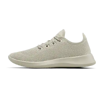 A beige, lightweight sneaker with a knit mesh upper, lace-up closure, and a thick, textured sole, shown in a side profile on a plain white background.