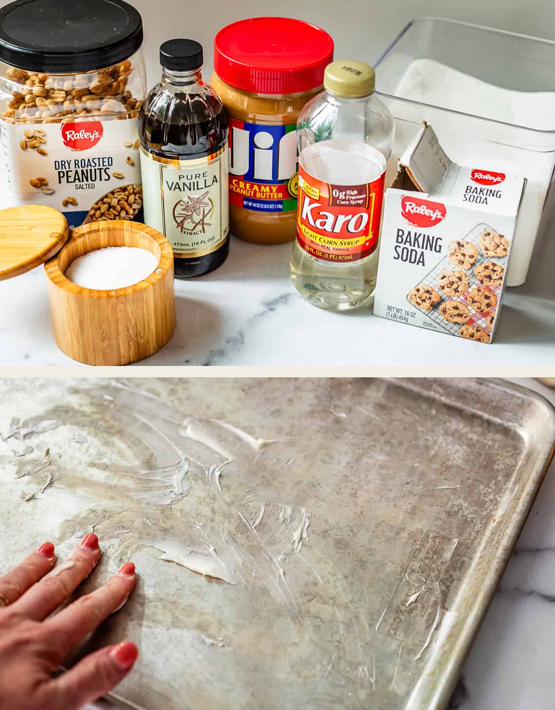 Assorted baking ingredients, including peanuts, vanilla, peanut butter, corn syrup, baking soda, sugar, and salt are on a counter. Below, a hand spreads grease on a baking sheet.