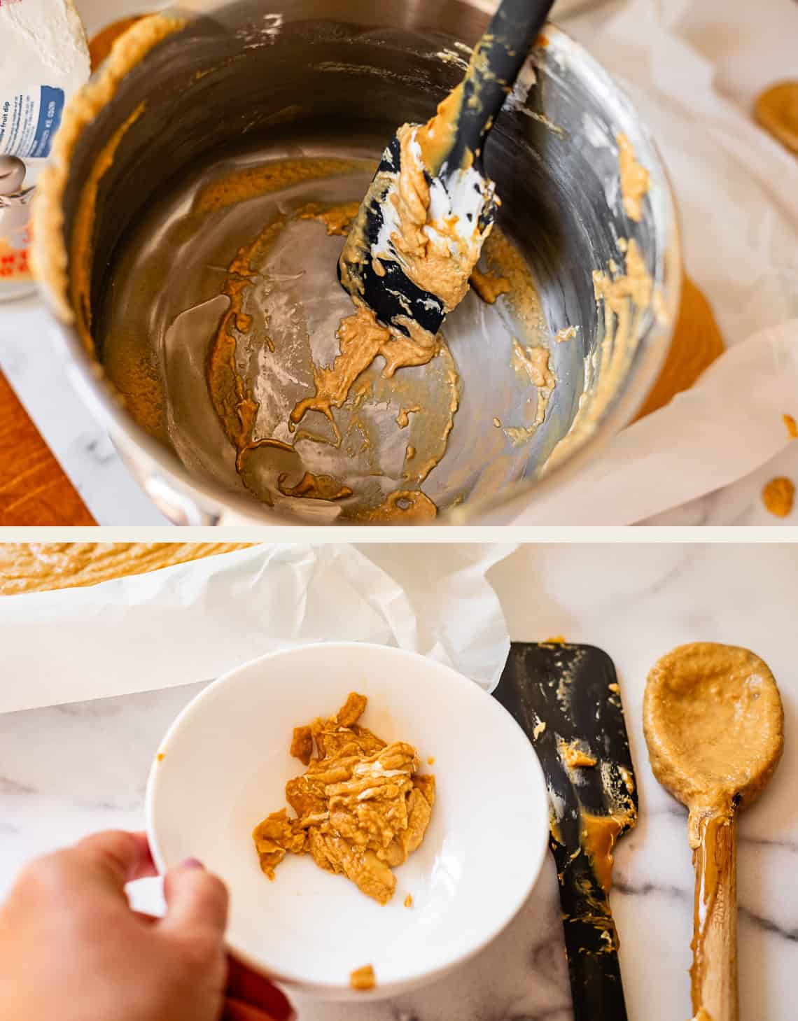 A spatula with peanut butter fudge rests in a mostly empty metal pot. Below, a hand holds a bowl with peanut butter fudge; nearby are a spatula and a wooden spoon coated with peanut butter fudge on a marble surface.