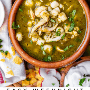 A bowl of chicken pozole verde garnished with cilantro, surrounded by radish slices, lime wedges, tortilla chips, and a napkin. Text below reads: Easy Weeknight Chicken Pozole Verde The Food Charlatan.