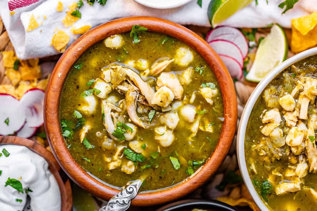 A bowl of soup with meat and vegetables.