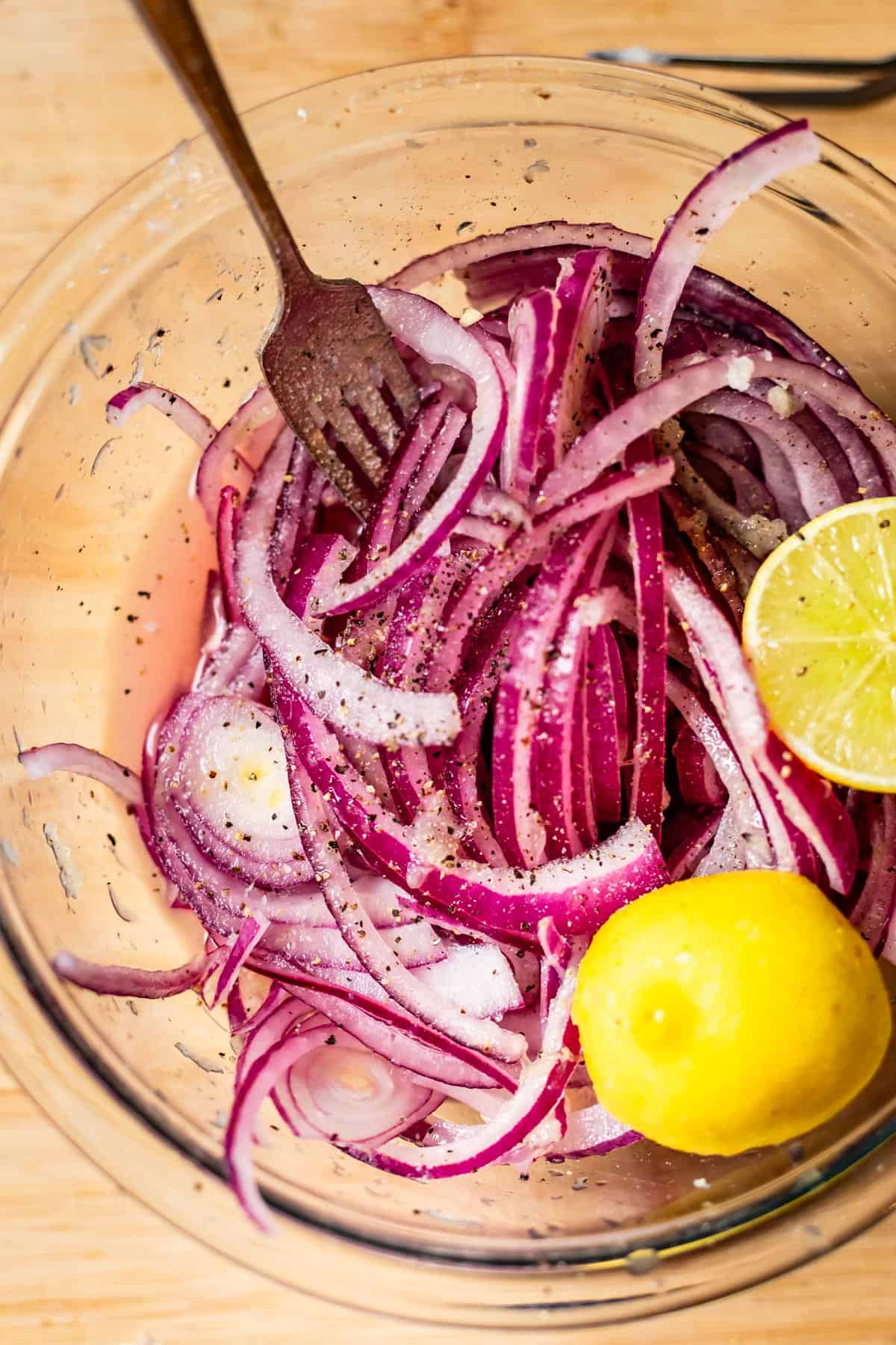 A bowl of chopped onions and lemons.