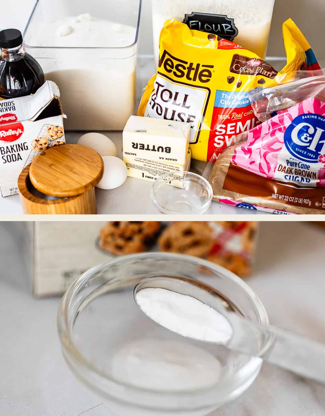 A variety of chocolate chip cookie ingredients on a counter, including flour, sugar, brown sugar, butter, eggs, vanilla extract, baking soda, salt, and a bag of chocolate chips. A spoon of baking soda is shown in a bowl.