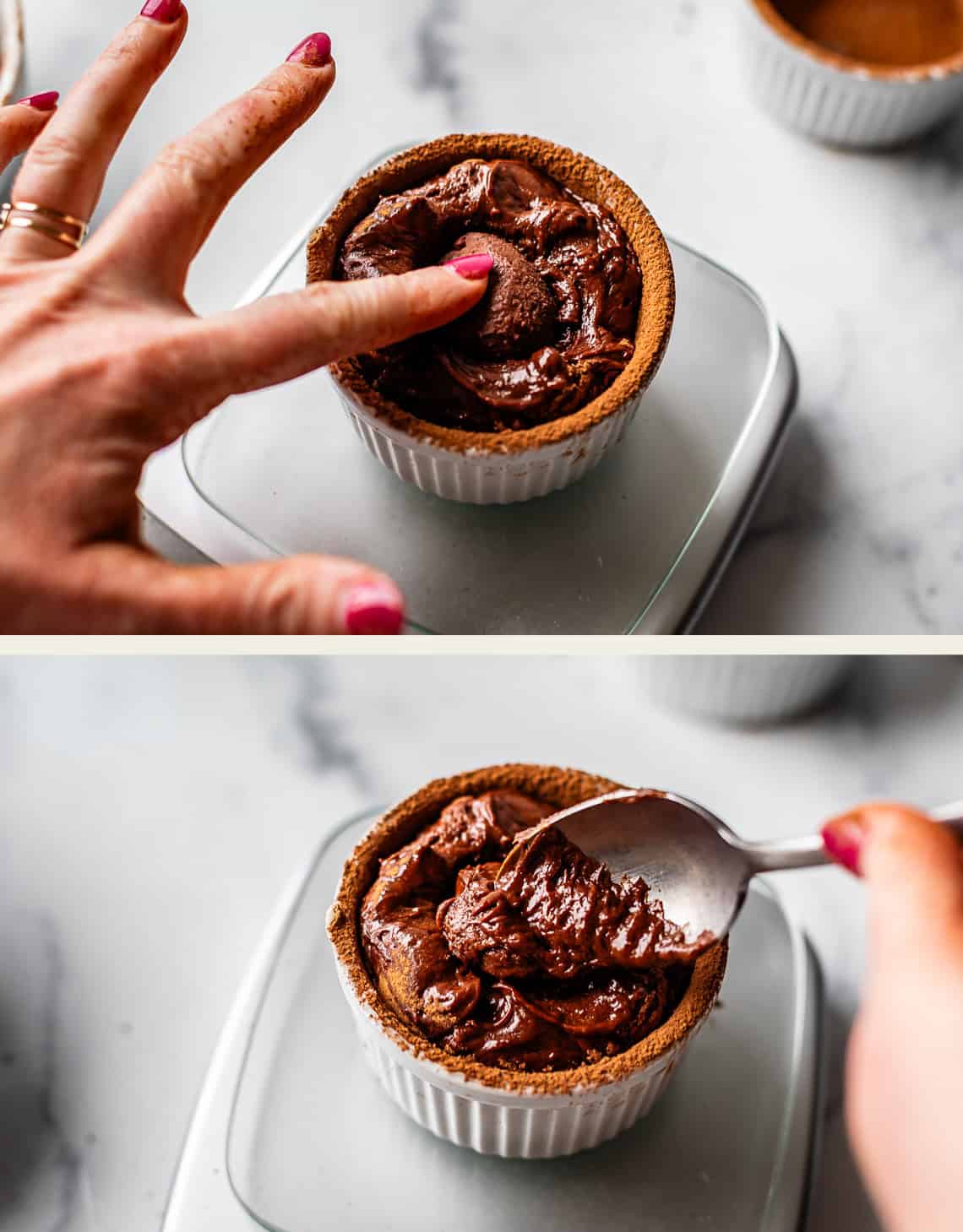 Top image: A hand pressing into the center of a chocolate souffl&eacute; in a white ramekin. Bottom image: A spoon scooping out some of the rich chocolate souffl&eacute;. Both images are on a light-colored surface.