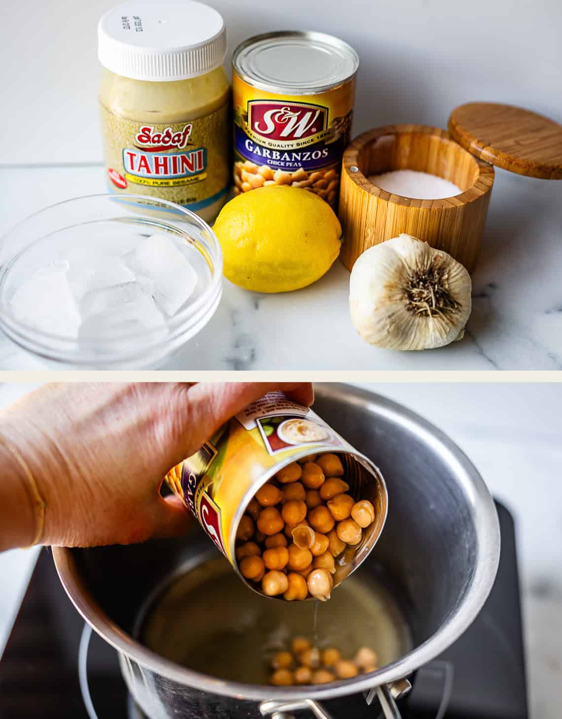 Two images: Top shows tahini, canned garbanzo beans, a lemon, salt in a wooden container, garlic, and a bowl of ice water on a counter. Bottom shows garbanzo beans being poured from a can into a pot on a stove.