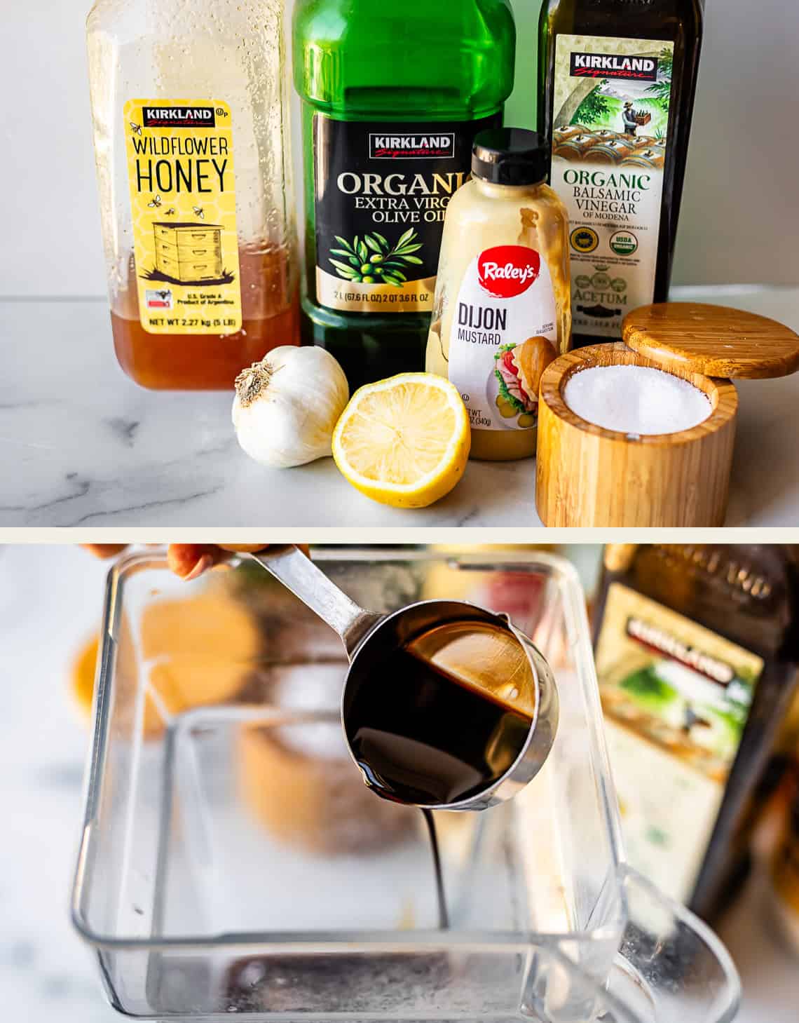 A selection of ingredients for a dressing, including honey, olive oil, balsamic vinegar, garlic, lemon, mustard, and salt, displayed on a counter, with a measuring cup pouring balsamic vinegar into a clear container.