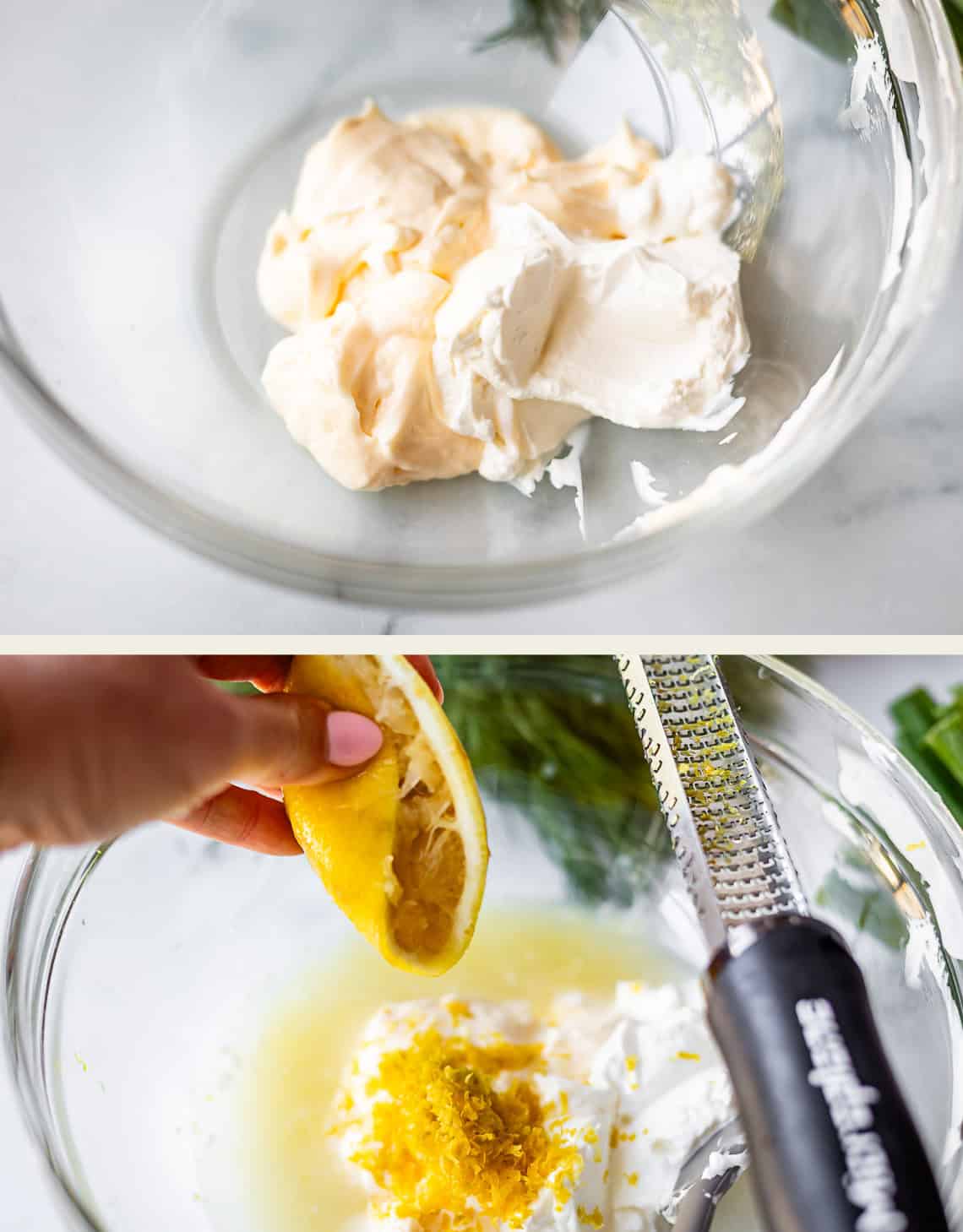 A glass bowl with cream cheese and mayonnaise; in the next step, a hand squeezes a lemon and adds zest to the mixture with a grater beside the bowl.
