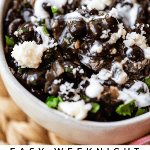 A close-up of a bowl filled with Mexican-style black beans, garnished with crumbled cheese, cilantro, and sliced radish. Text at the bottom reads: Easy Weeknight Mexican Style Black Beans..