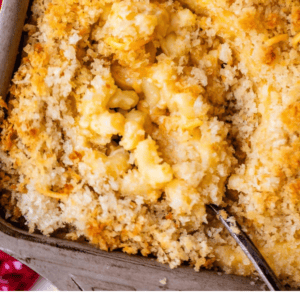 Baked macaroni and cheese with a breadcrumb topping in a baking dish. Text says Easy Homemade Macaroni and Cheese, The Food Charlatan.